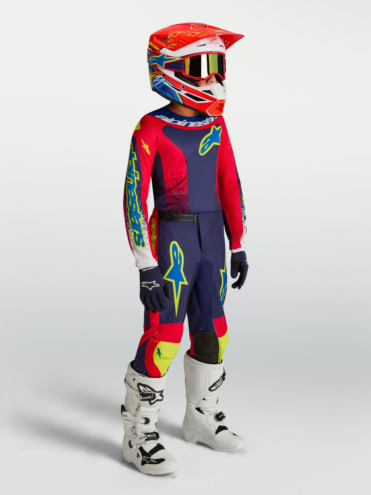 Alpinestars 2027 Youth Fluid Drag Gear Set, kids motocross racing kit in Blue Navy and Fire Red with white boots.