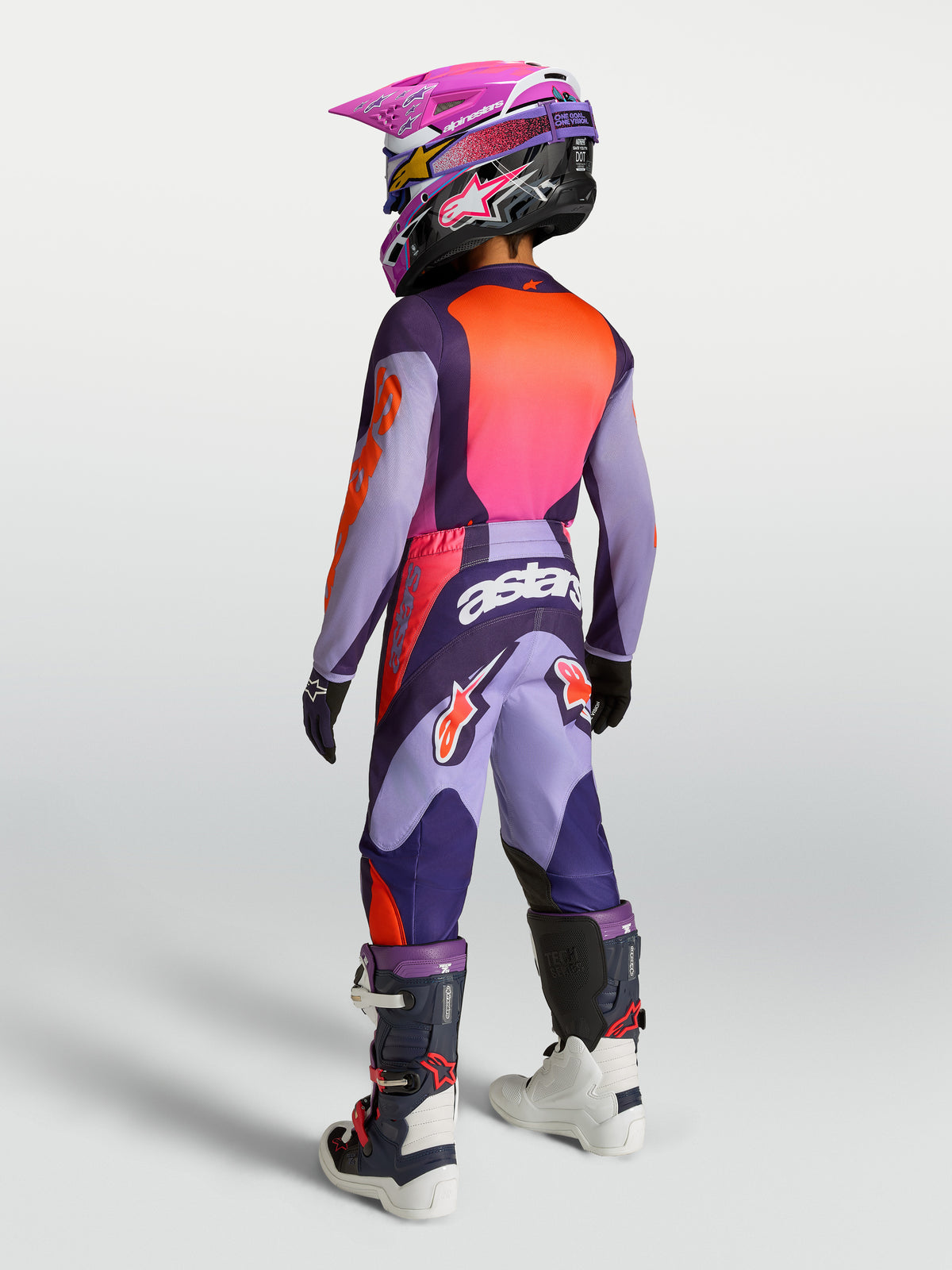Alpinestars 2027 Fluid Hunt trøje og udstyrssæt til ungdom, lilla og pink fluo, åndbart motocrossudstyr, set bagfra.