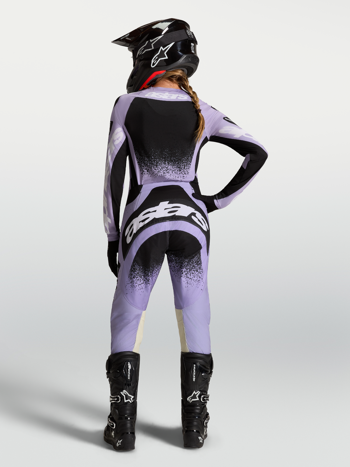 Alpinestars Stella Techstar Swan Pants, women's purple and black motocross racing pants in an on-model rear view.