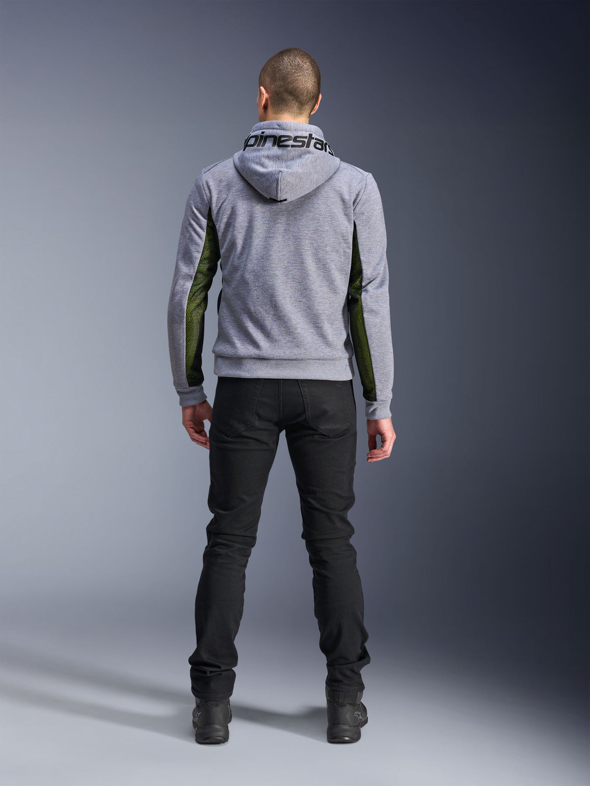 Alpinestars Chrome Air Sport Hoodie, Gray Heather Black, back view of motorcycle riding hoodie featuring green high-flow mesh panels on the sides and sleeves, tech fleece construction with Alpinestars branding on the hood, worn with black pants