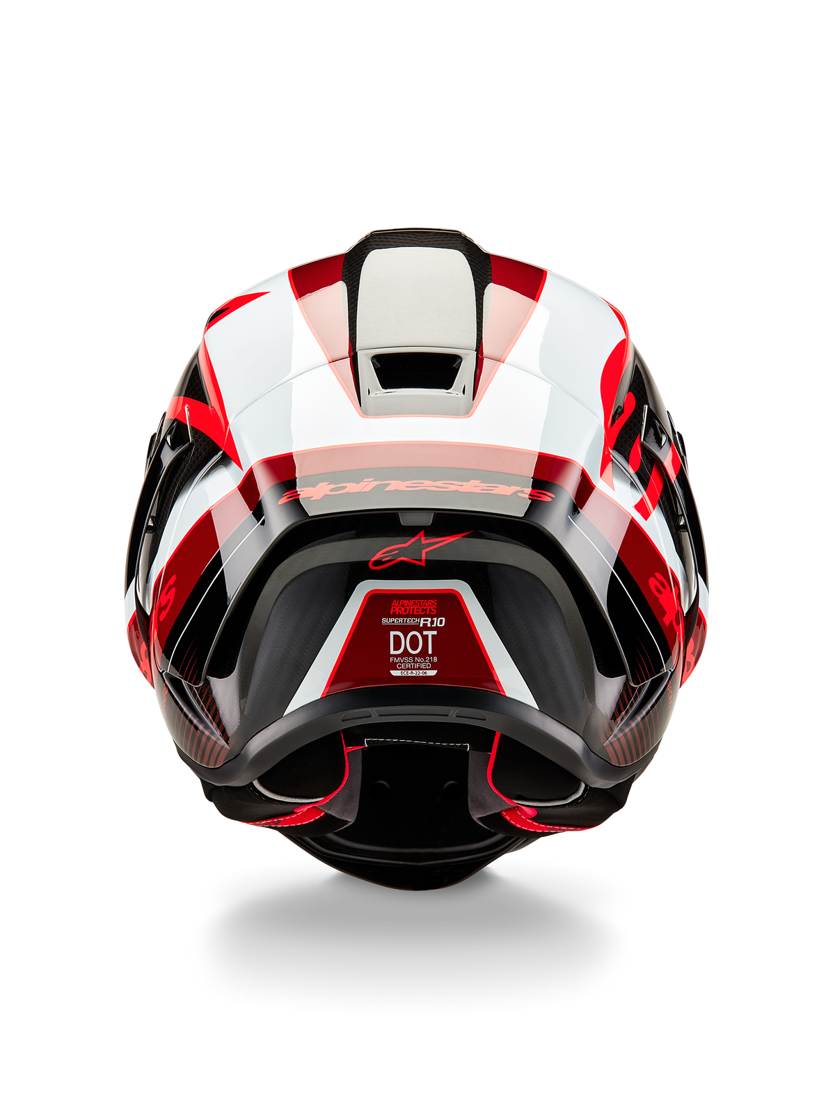 Alpinestars Supertech R10 Team hjelm, set bagfra, blank sort karbon, rød og hvid, aerodynamisk skaldesign med markante røde og hvide paneler, med Alpinestars-branding på spoileren og et rødt stjernelogo, professionel motorcykelhjelm til racing