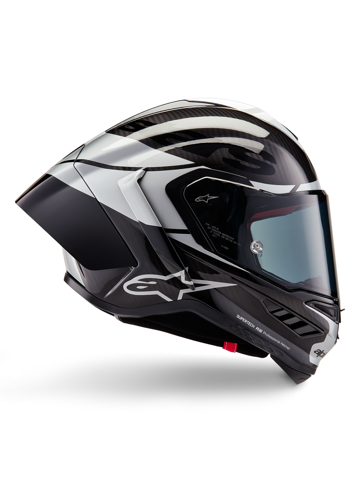 Alpinestars Supertech R10 Element-hjelm, full-face motorcykelracerhjelm, sort carbon, sølv og blank sort finish, sideprofil med aerodynamisk kulfiberskal, klart visir og markant Alpinestars-branding.
