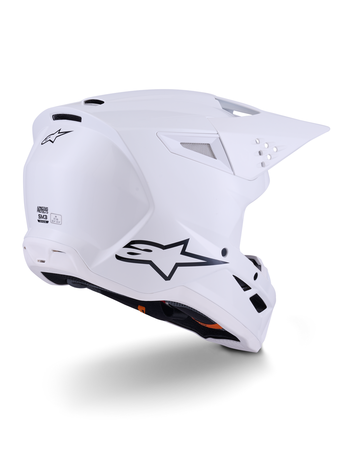 Alpinestars S-M3 Solid hjelm, motocross-hjelm, blank hvid, trekvartvisning bagfra der viser sort Alpinestars-logo, ventilationsåbninger og aerodynamisk skaldesign til off-road kørsel.