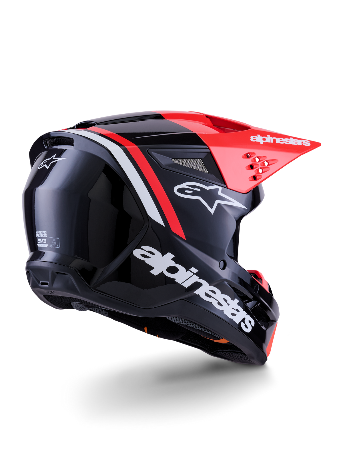 Alpinestars S-M3 Radium hjelm, motocross-hjelm, blank sort, neonrød og hvid, trekvartvisning bagfra der viser strømlinet aerodynamisk design, hvidt logo og klar rød skygge, højtydende beskyttelsesudstyr til terrænkørsel