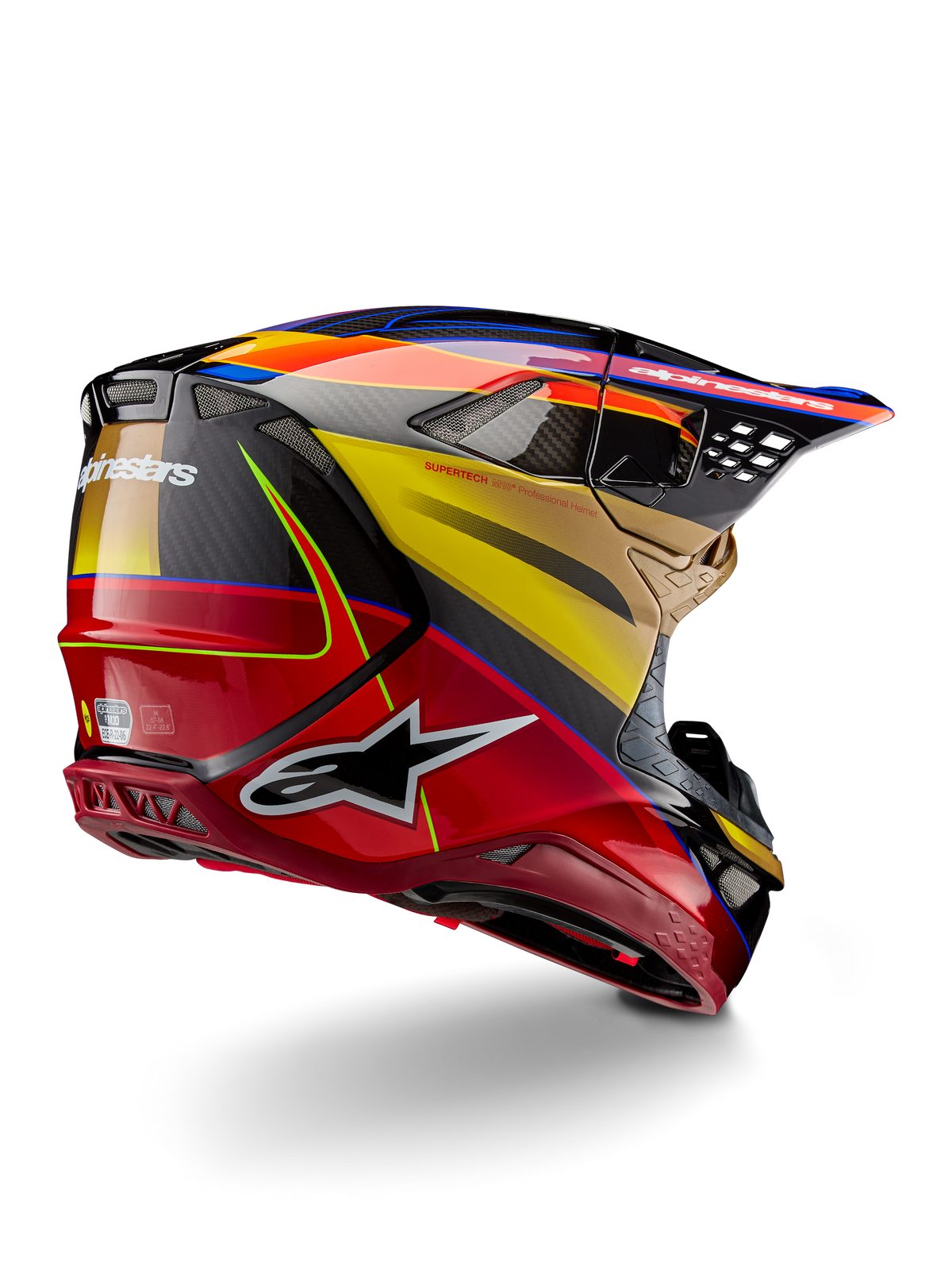 Alpinestars Supertech M10 Era hjelm, motocross-hjelm, guld, gul og Rio-rød blank, set bagfra i trekvart profil, kulfiberskal med rød og gul grafik, blå detaljer, aerodynamisk profil med flere ventilationsporte og et tydeligt Astar-logo.