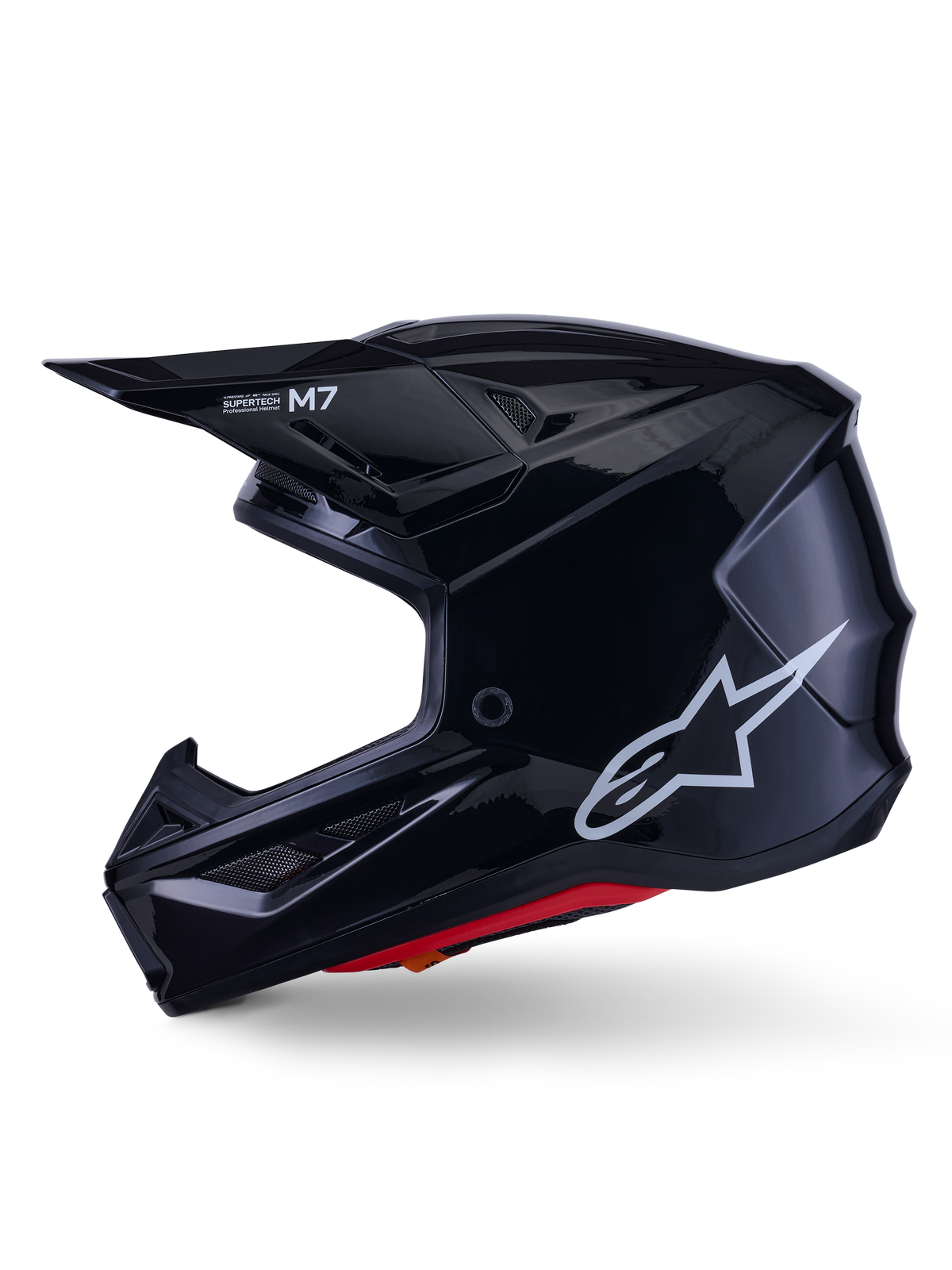 Alpinestars S-M7 Solid Helmet, Glossy Black Motocross Helmet, side profile showing white Alpinestars logo, aerodynamic shell with ventilation mesh and red interior padding, advanced off-road protection