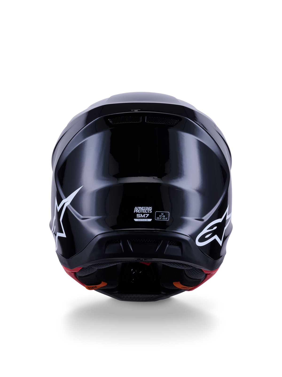 Alpinestars S-M7 Solid Helmet ECE 22.06, Motocross Helmet, Glossy Black, rear view featuring white star logos, aerodynamic composite shell with a high-shine finish, safety certification and size labels in the center