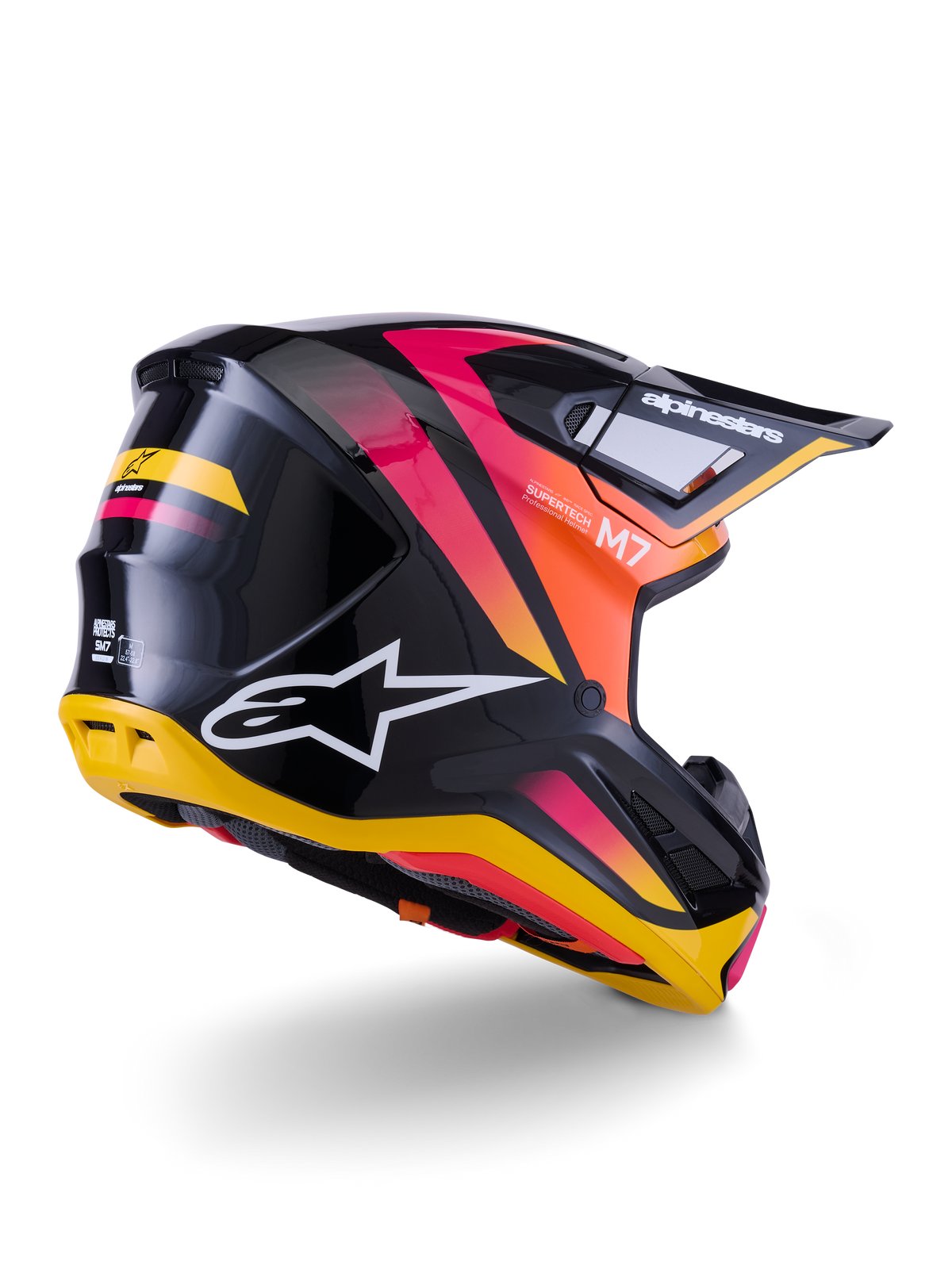 Alpinestars S-M7 Rise-hjelm, motocrosshjelm, sort, gul og pink blank finish, set bagfra og fra siden med aerodynamisk komposit-skal, levende farveovergange, markant branding og ventilationsåbninger