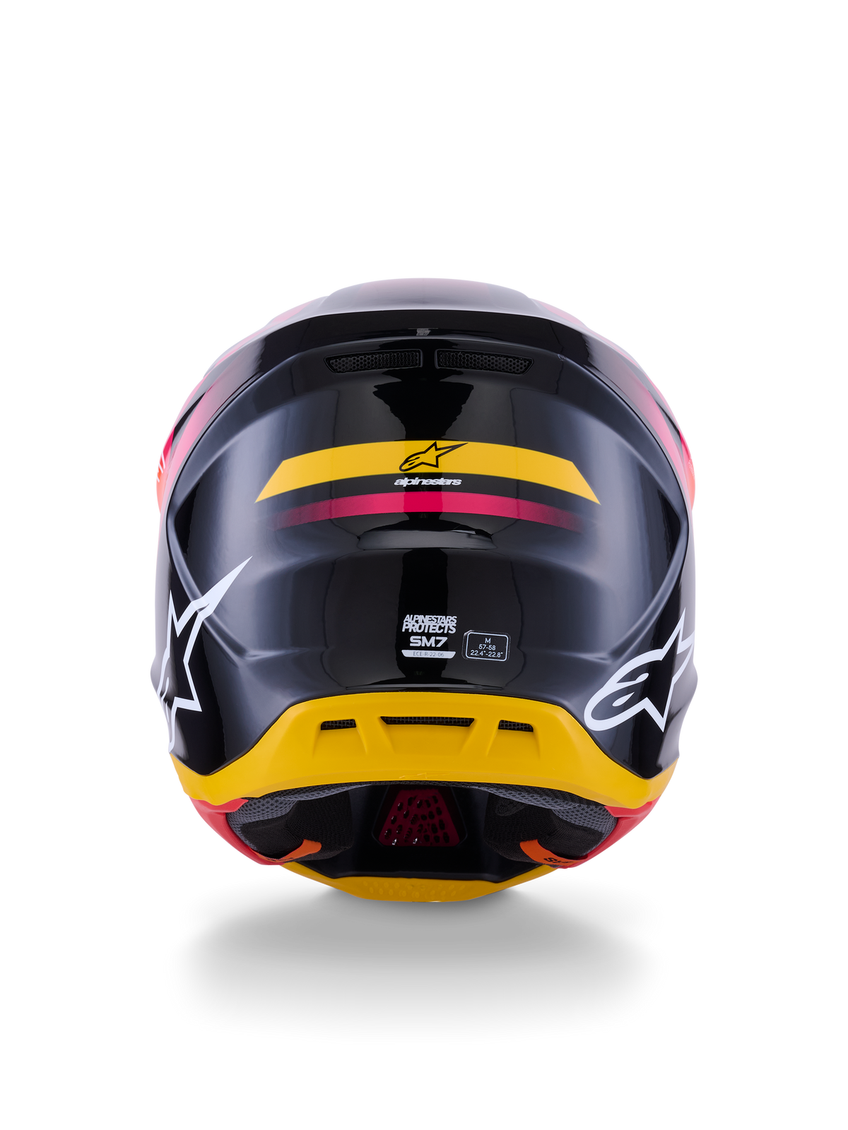 Alpinestars S-M7 Rise hjelm ECE 22.06, motocross-hjelm, set bagfra, blank sort med gule og lyserøde detaljer, store hvide logoer på siderne, aerodynamisk kompositskal, off-road racerudstyr