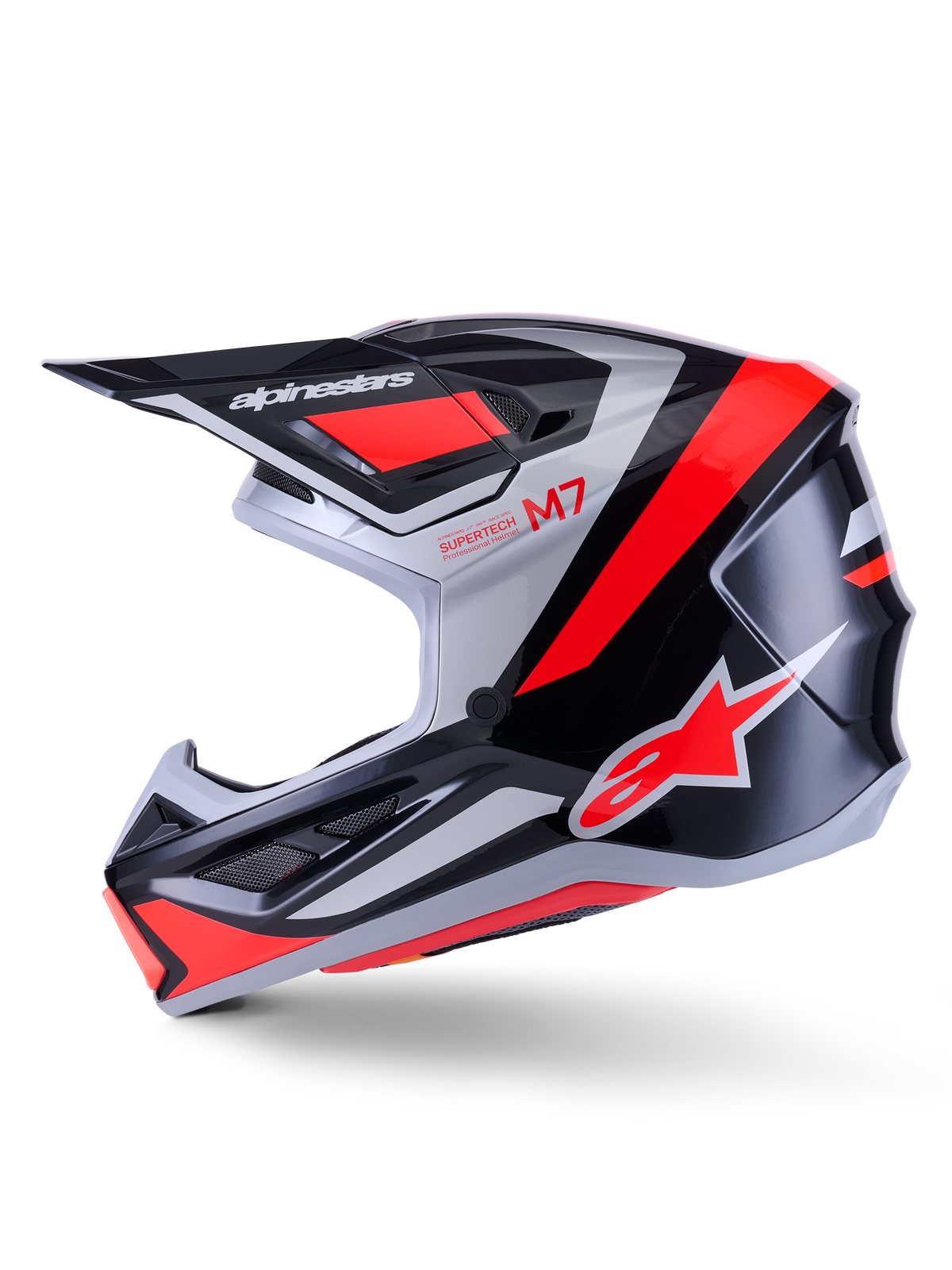 Alpinestars S-M7 Rise hjelm, motocrosshjelm, sort, sølv og blank rød fluo, profilvisning med en aerodynamisk kompositskal, ventileret hagebeskytter og en markant skygge med Alpinestars-branding.