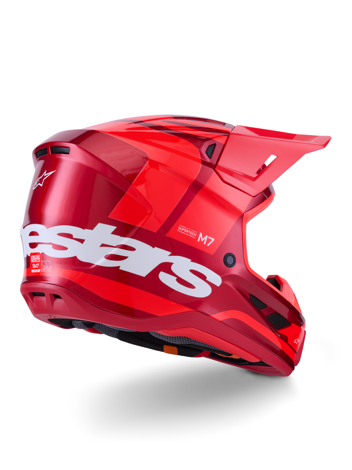 Alpinestars S-M7 Core Helmet, Motocross Helmet, Red Glossy with large white Alpinestars logo on the side, featuring an aerodynamic shell, integrated ventilation ports, and protective visor, 3/4 rear view