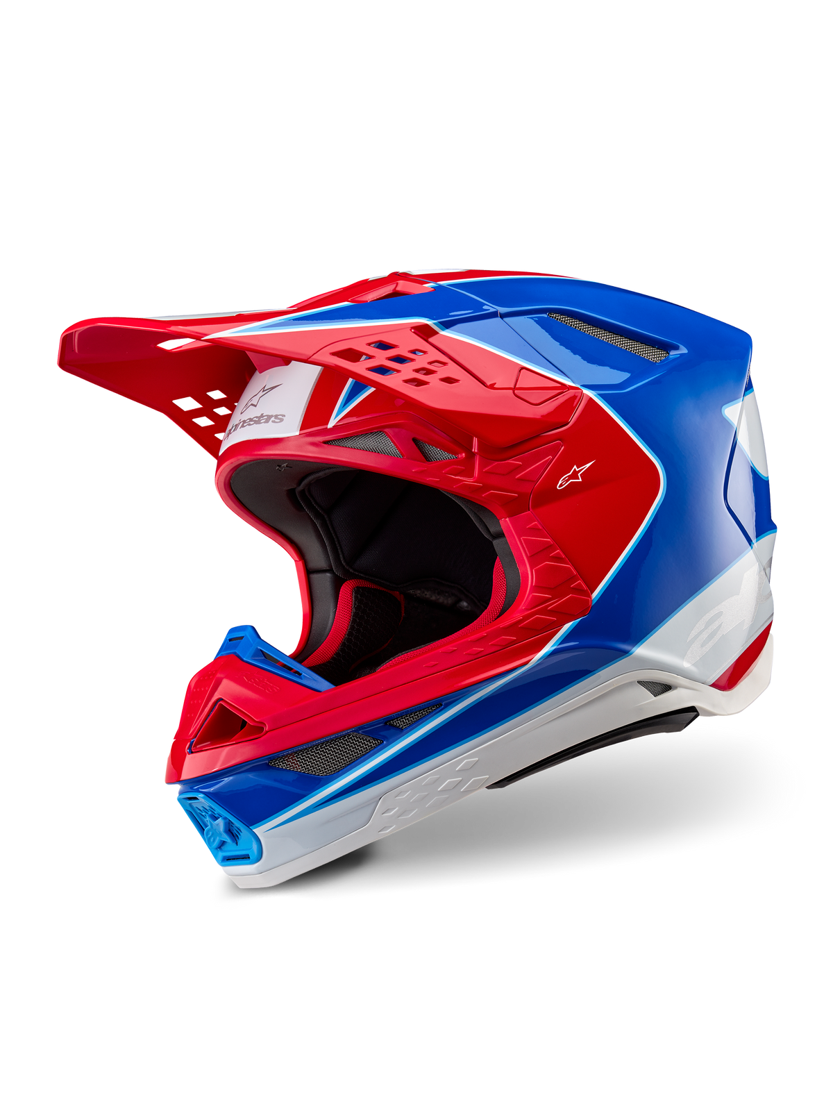 Alpinestars Supertech M10 Aeon Helmet, Motocross Helmet, Bright Red Blue Glossy, three-quarter view showing aerodynamic shell with multiple ventilation ports, white and red graphic accents, Alpinestars logo on visor and side, professional off-road racing gear