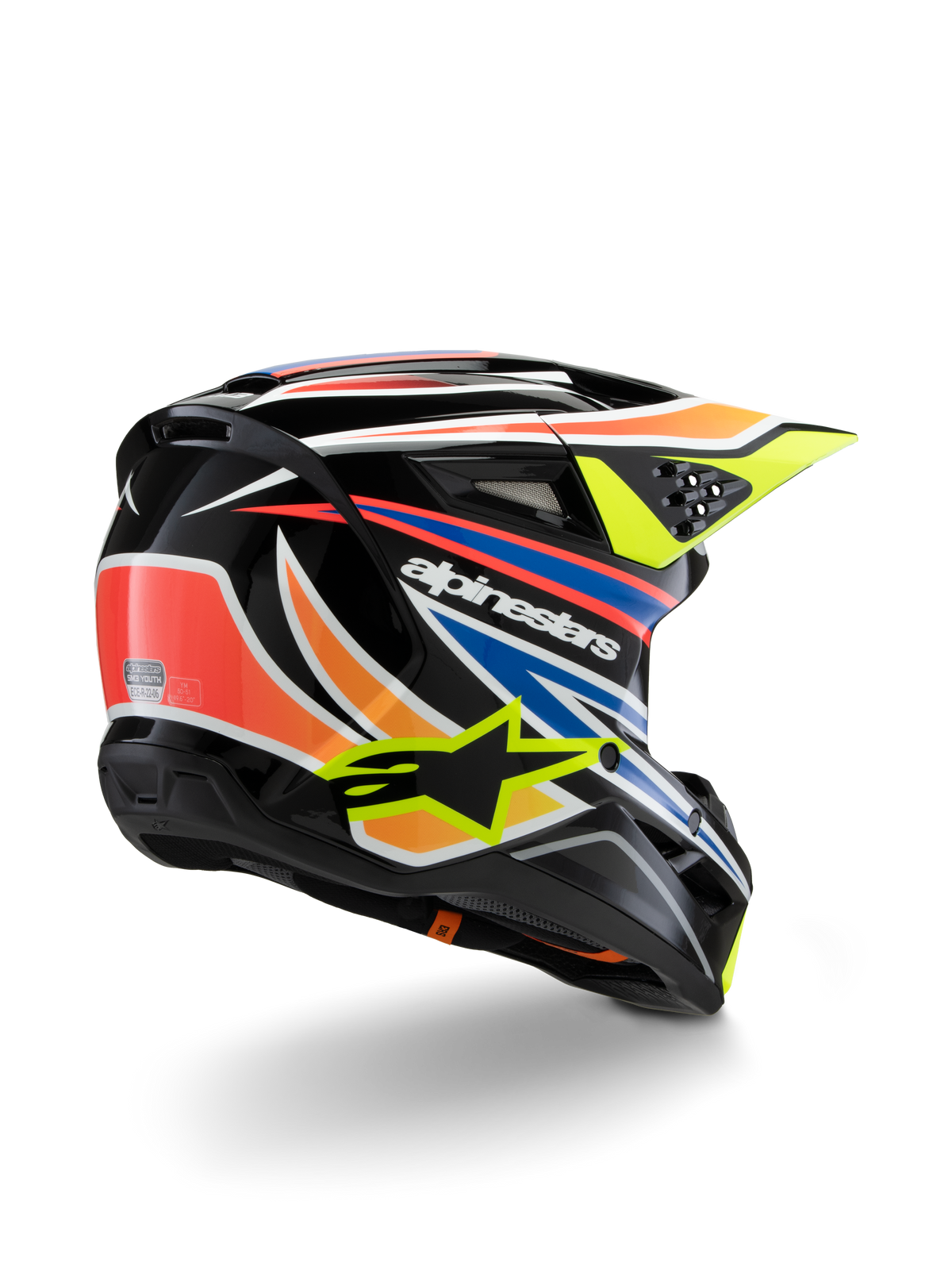 Alpinestars S-M3 Youth Wurx Helmet, Youth Motocross Helmet, Black with Vibrant Orange, Red, Blue, and Fluorescent Yellow Accents, rear three-quarter view showing aerodynamic shell and ventilation ports, glossy finish with bold Alpinestars branding.
