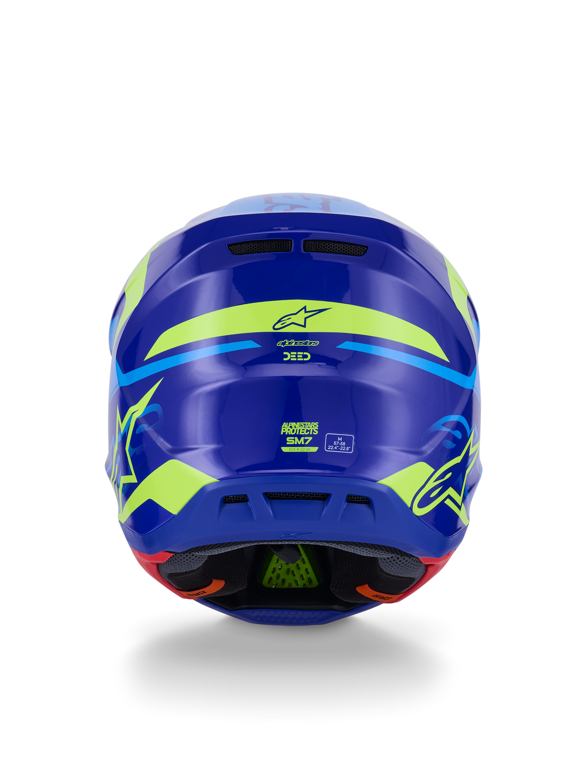 Alpinestars S-M7 Deed Hjelm ECE 22.06, motocross-hjelm, set bagfra, blå gul fluo blank, med markant fluorescerende gul grafik og stjernelogoer, bageste udluftningsporte og synlig indvendig polstring med grøn PLASMA-teknologi.