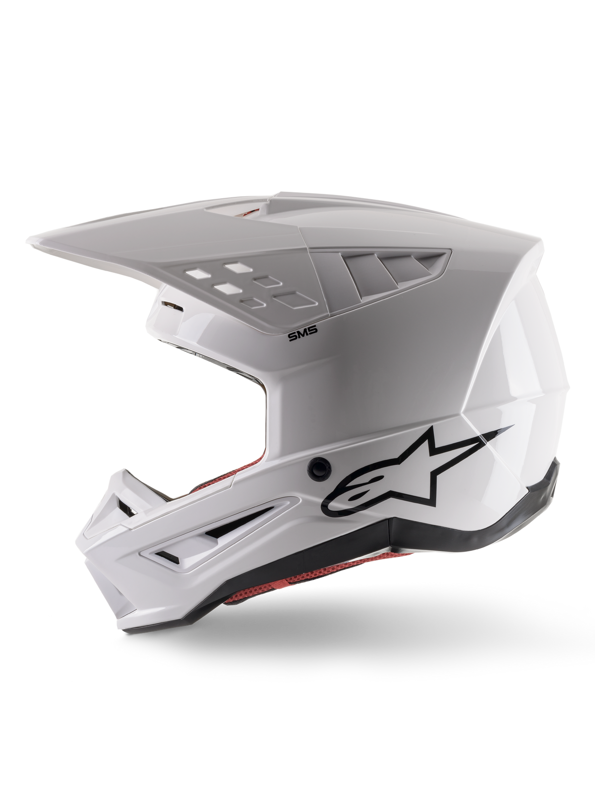 Alpinestars S-M5 Solid-hjelm ECE 22.06, motocross-hjelm, blank hvid, sideprofil med kantet skal-design, sort Alpinestars-logo på siden, flere ventilationsåbninger og integreret visir til off-road racing.