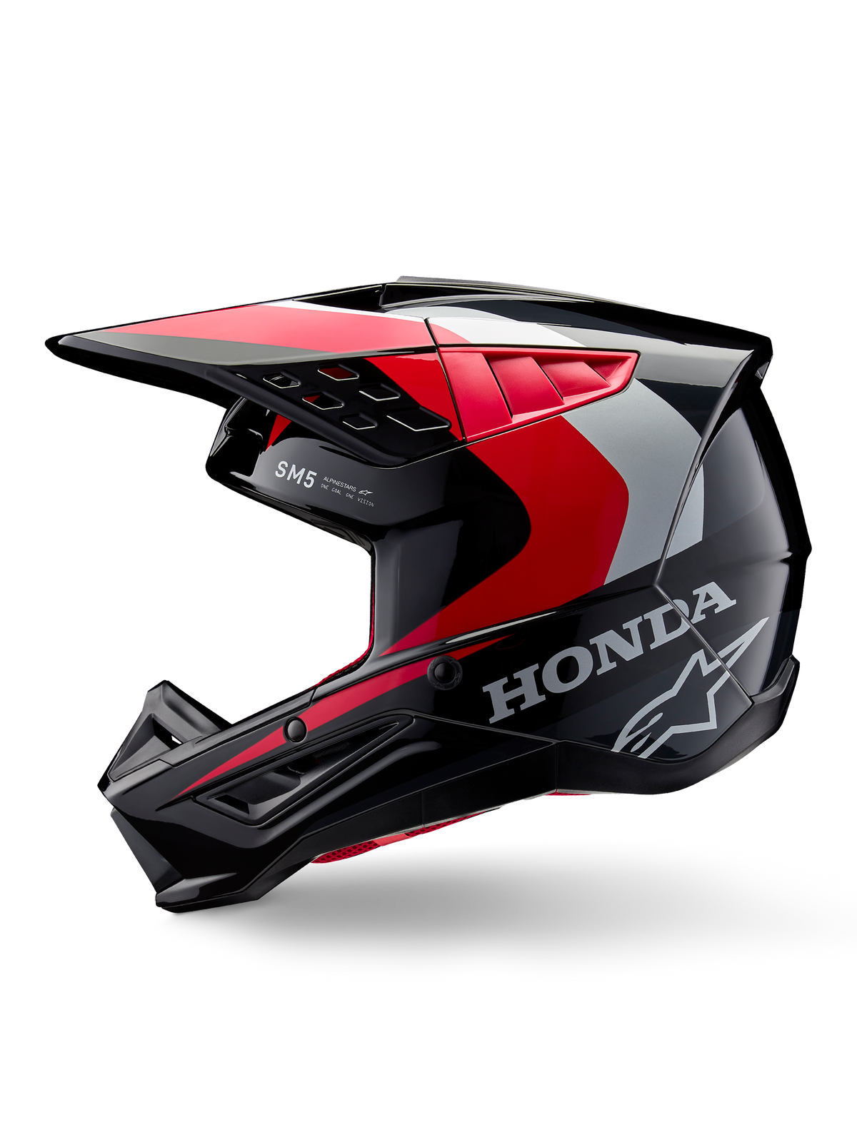 Alpinestars Honda S-M5 hjelm, motocross-hjelm, blank sort, rød og sølv, set fra siden med Honda-branding og Alpinestars stjernelogo, strømlinet design med integreret skygge og ventilationsporte til terrænkørsel