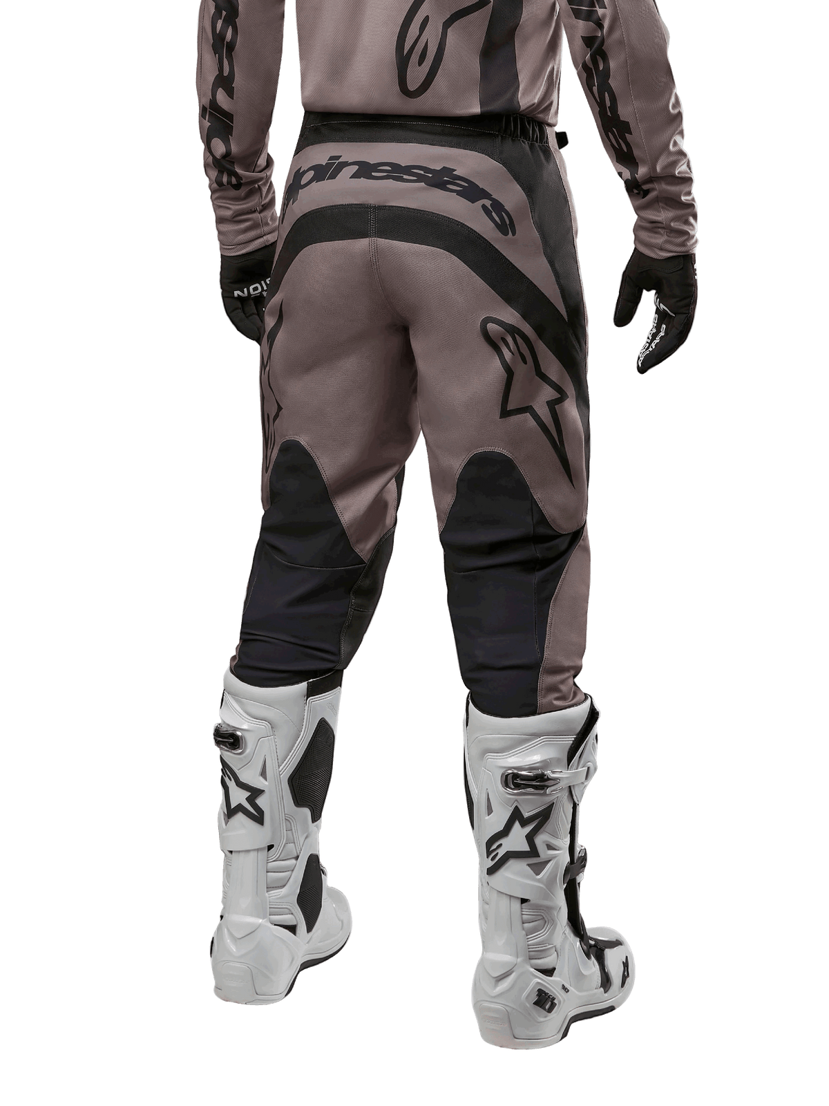Alpinestars 2024 Fluid Lurv Pants, Motocross Pants, Mud Black, back view showing large black Alpinestars logo on the seat and black calf panels, worn with white and black motocross boots and matching jersey.
