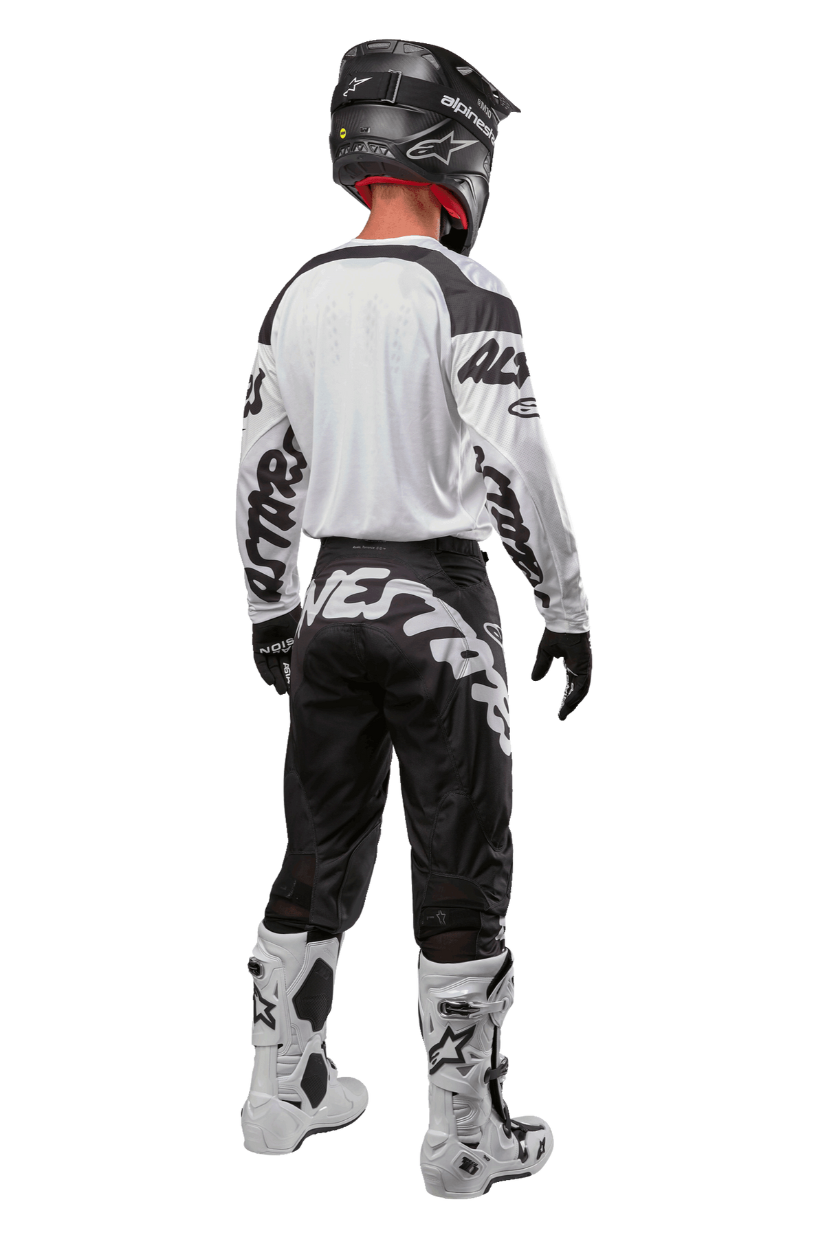 Alpinestars 2024 Racer Hana bukser, motocross-udstyr, sort og hvid, komplet raceroutfit set bagfra med sort hjelm, hvid trøje med sorte logoer, sorte handsker og hvide støvler, beskyttelsesudstyr til terrænkørsel