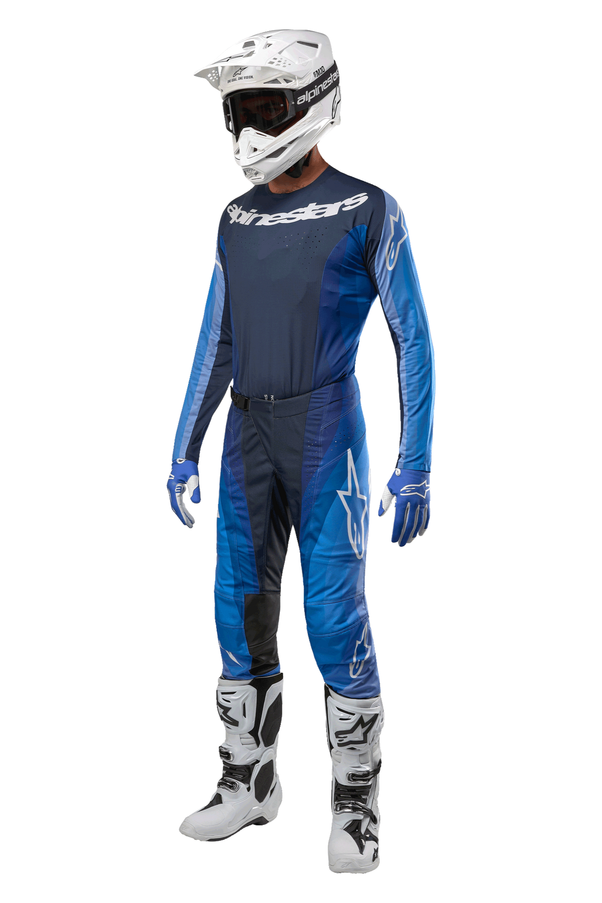 Alpinestars 2024 Techstar Pneuma Pants, Motocross Pants, Dark Navy and Light Blue, full racing kit featuring matching jersey, white helmet with goggles, blue and white gloves, and white boots, professional off-road gear setup