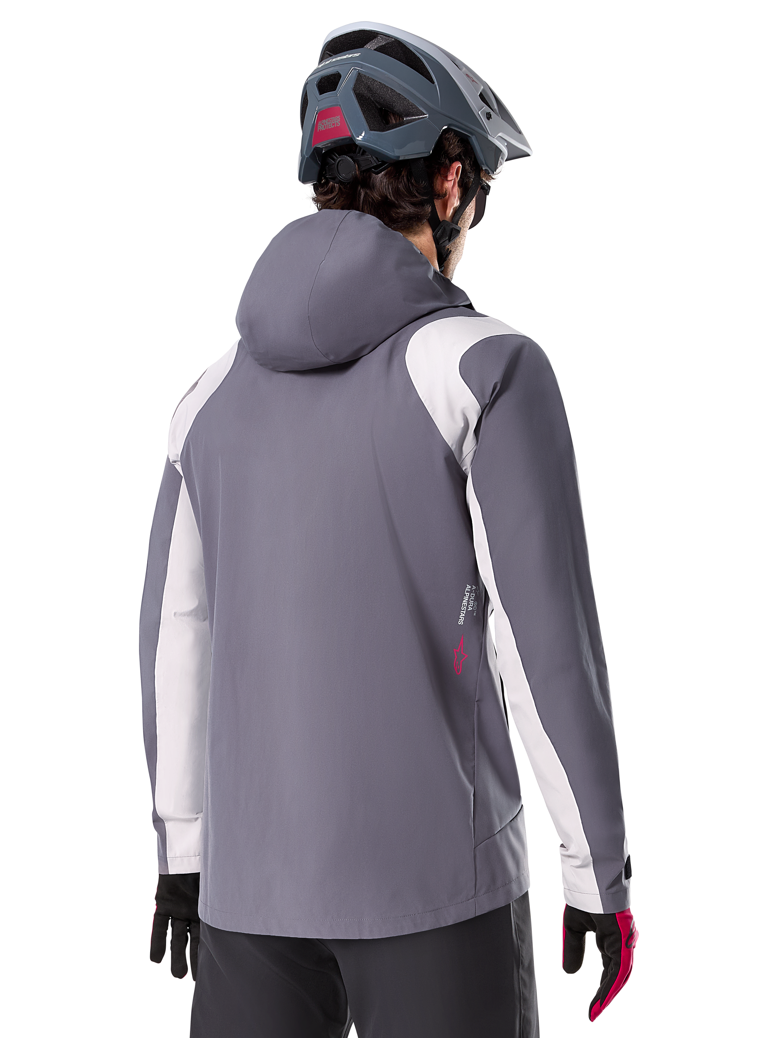 Alpinestars A-Dura Rain Jacket, Mountain Bike Jacket, Dark Titanium Gray, back view featuring light gray shoulder and arm panels, red logo detail on the side, worn with a gray MTB helmet and black and red gloves, technical trail riding apparel
