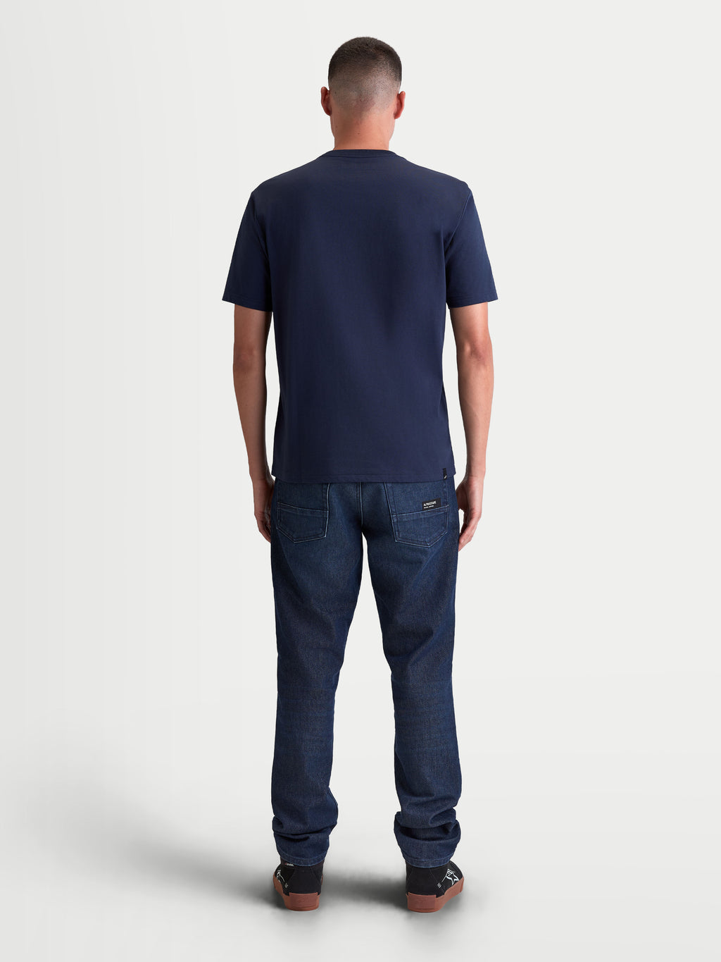 Alpinestars Ageless 2.0 CSF Tee, Men's Sportswear Short Sleeve T-Shirt, Navy Blue, rear view on-model showing the structured cut-and-sew fit and premium cotton-poly blend construction for everyday casual wear.