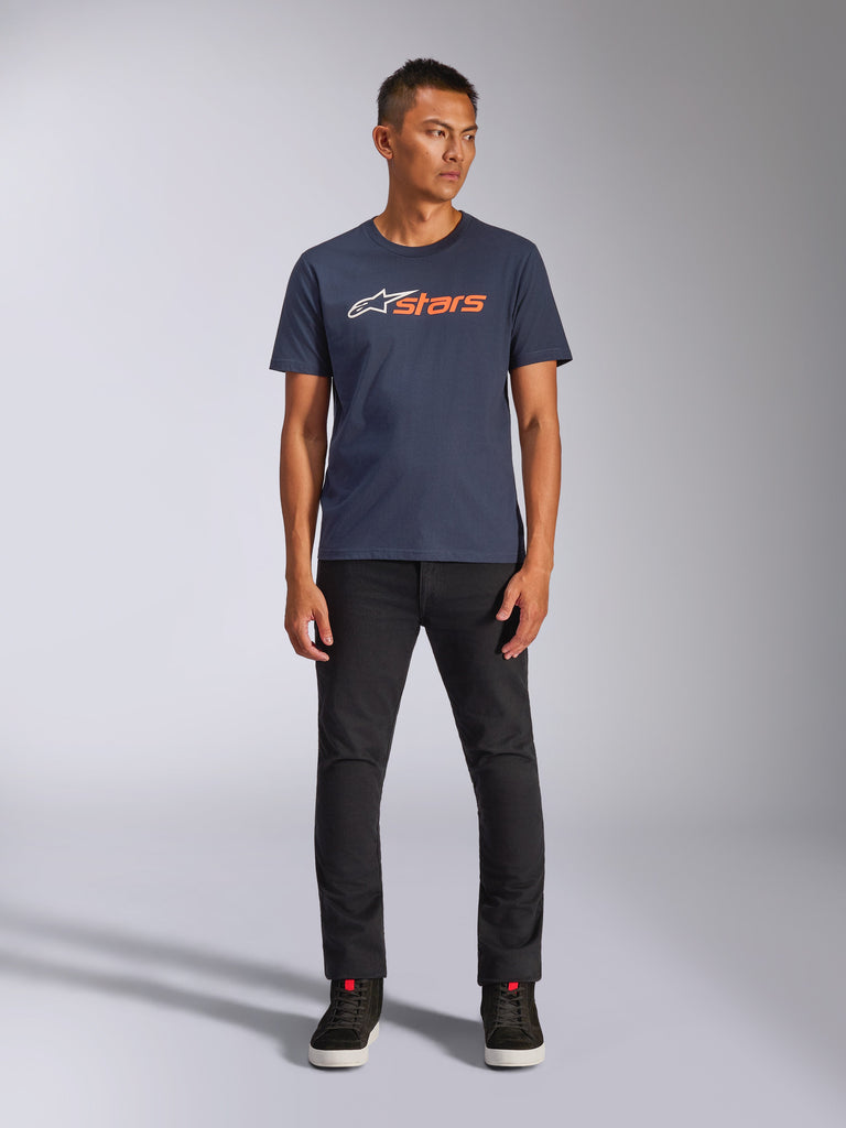 Alpinestars Blaze 2.0 CSF Tee, Short Sleeve T-Shirt, Navy Blue with White and Orange Astars Logo, worn with black pants and black sneakers, casual motorsport-inspired streetwear