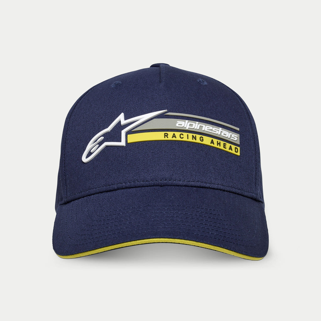 Alpinestars Par Hat, Navy Blue, structured snapback cap with curved bill, featuring 3D white Astars logo and 'alpinestars RACING AHEAD' graphic in grey and yellow, yellow sandwich bill accent, casual motorsport streetwear