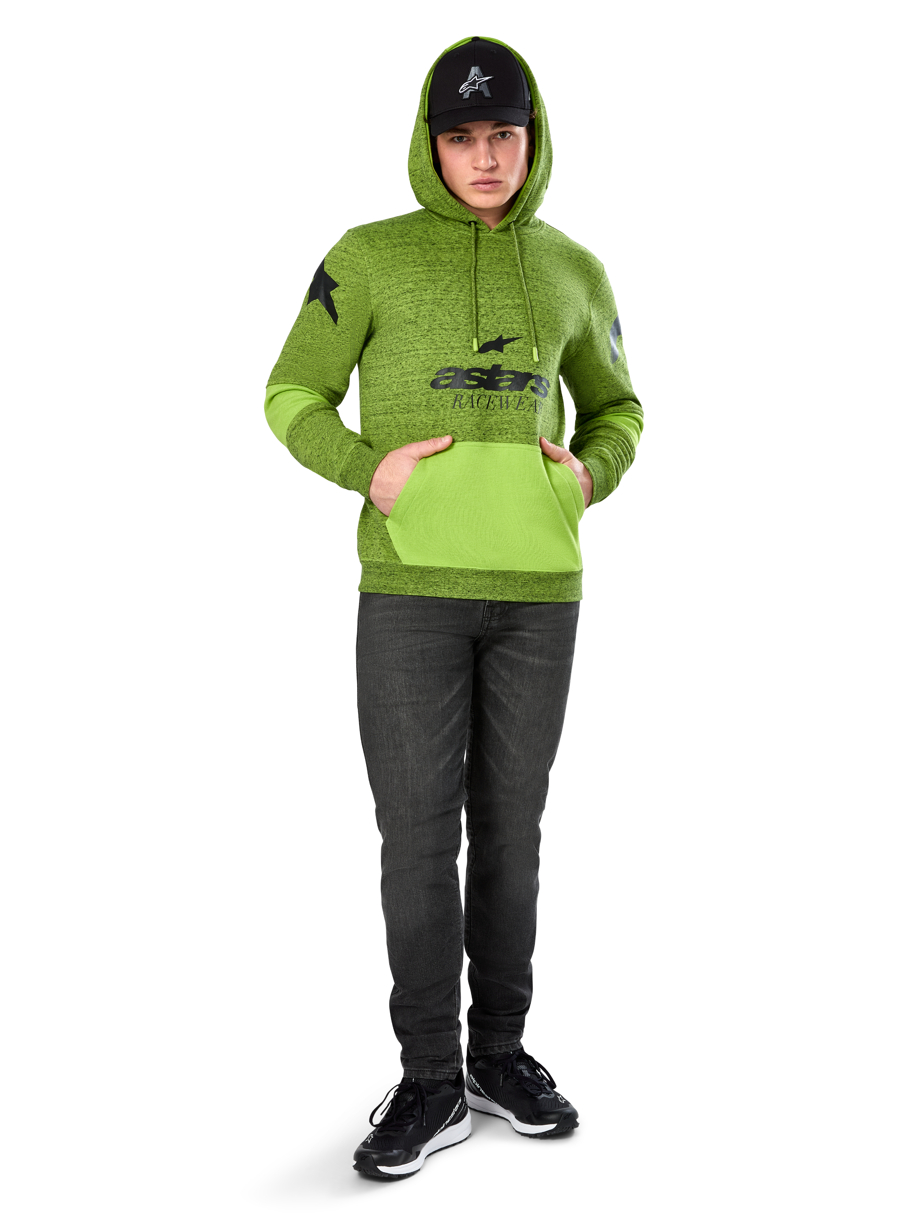 Alpinestars Perpetuate Hoodie, Lime Green heather pullover fleece with contrasting bright green kangaroo pocket and sleeve panels, black 'astars' front graphic, styled with a black cap and dark jeans, casual motorsport-inspired streetwear