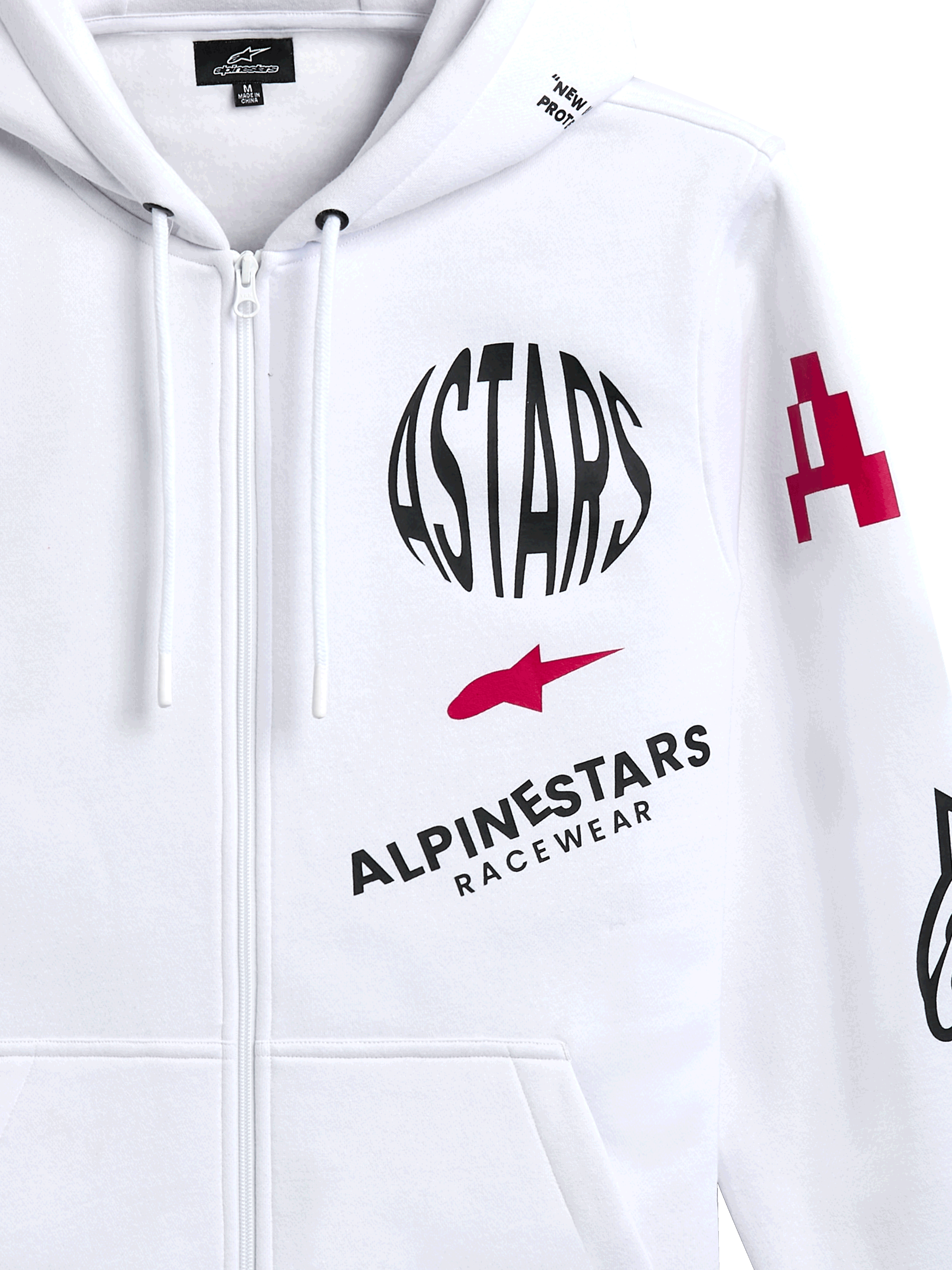 Alpinestars Variegate Hoodie, white zip-front fleece hoodie, featuring circular black ASTARS logo, red star symbol, and Alpinestars Racewear branding on the chest, casual motorsport streetwear