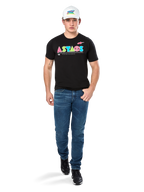 Male model wearing Alpinestars Cereal CSF Tee, Black Short Sleeve T-Shirt with colorful geometric ASTARS logo, paired with blue jeans and white cap, casual motorsport-inspired streetwear.