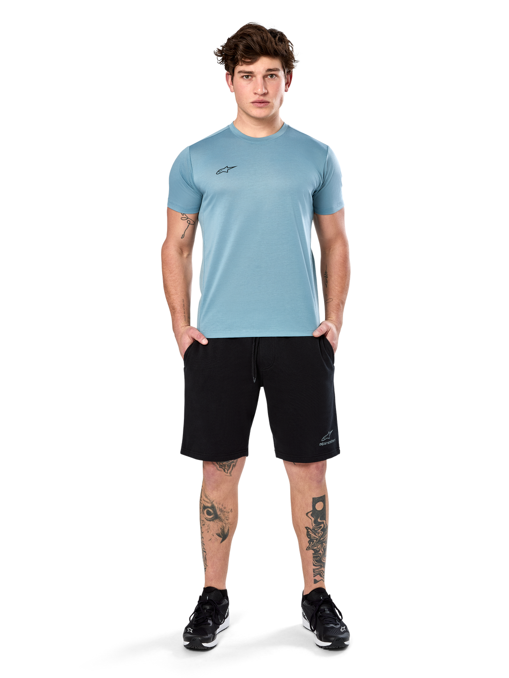 Alpinestars Point Performance Tee, Short Sleeve T-Shirt, Ice Blue, featuring a small black front logo, crew neck, worn by a model with black shorts and black sneakers, casual moisture-wicking sportswear