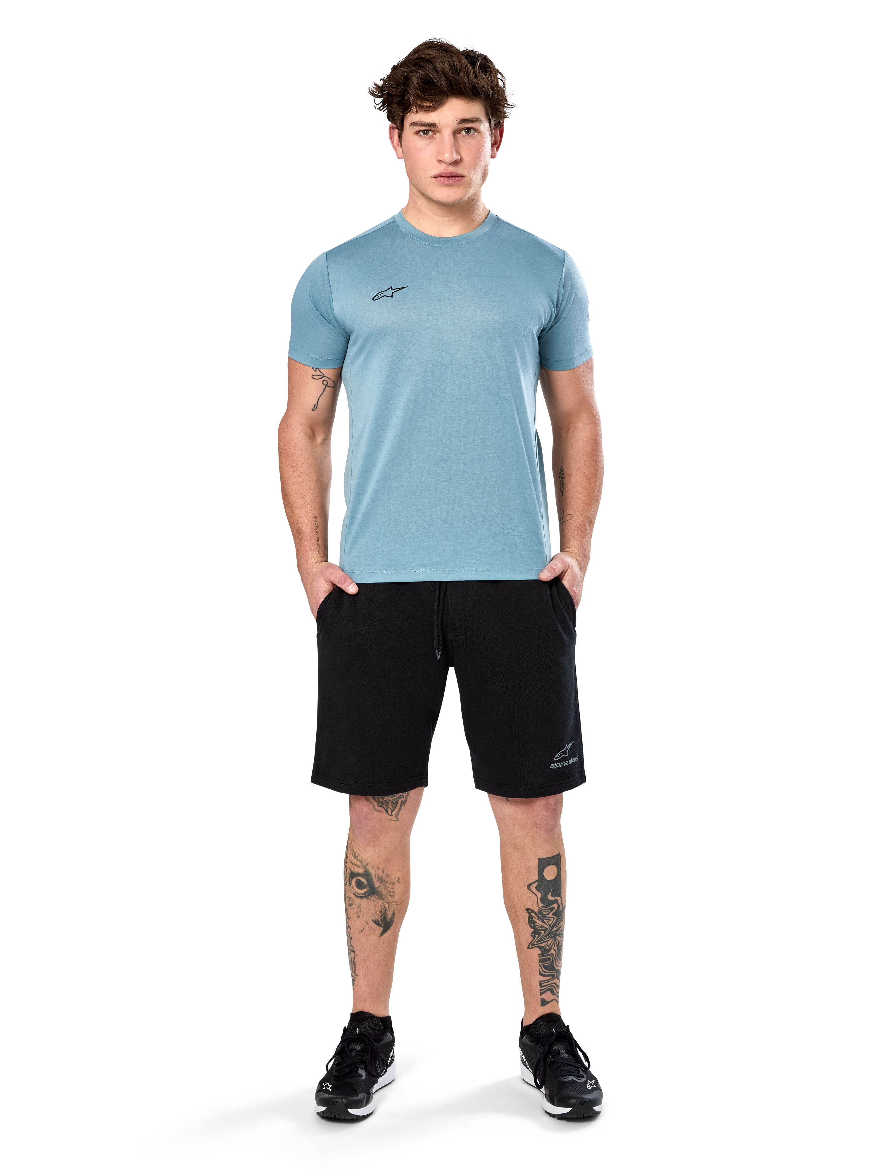 Alpinestars Point Performance Tee, Short Sleeve T-Shirt, Ice Blue, featuring a small black front logo, crew neck, worn by a model with black shorts and black sneakers, casual moisture-wicking sportswear