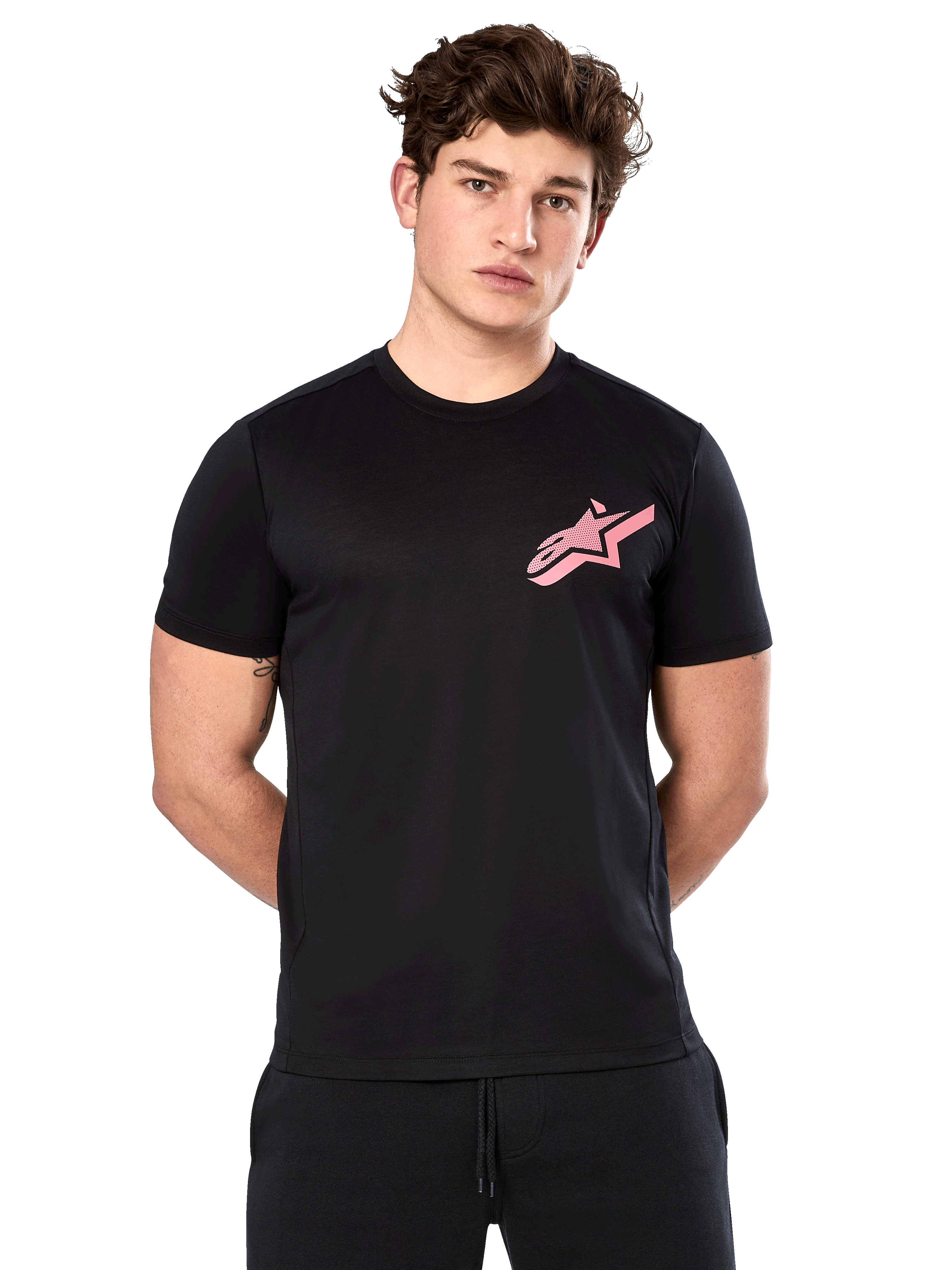 Alpinestars Attrition Performance Tee, Short Sleeve T-Shirt, Black with Pink Astars Logo on chest, worn by male model, Casual Motorsport Performance Wear