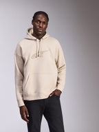 Alpinestars Emergent Oversized Hoodie, casual streetwear, off-white fleece med tone-i-tone 3D-broderet logo, kængurulomme, hætte med snøre, oversized pasform for en moderne silhuet