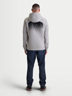 Alpinestars Obsessed hættetrøje, herre-sportstøj i fleece, cementgrå og sort, set bagfra med stor MX-inspireret gradientgrafik, afslappet motorsport-livsstilstøj med hætte og ribkanter.