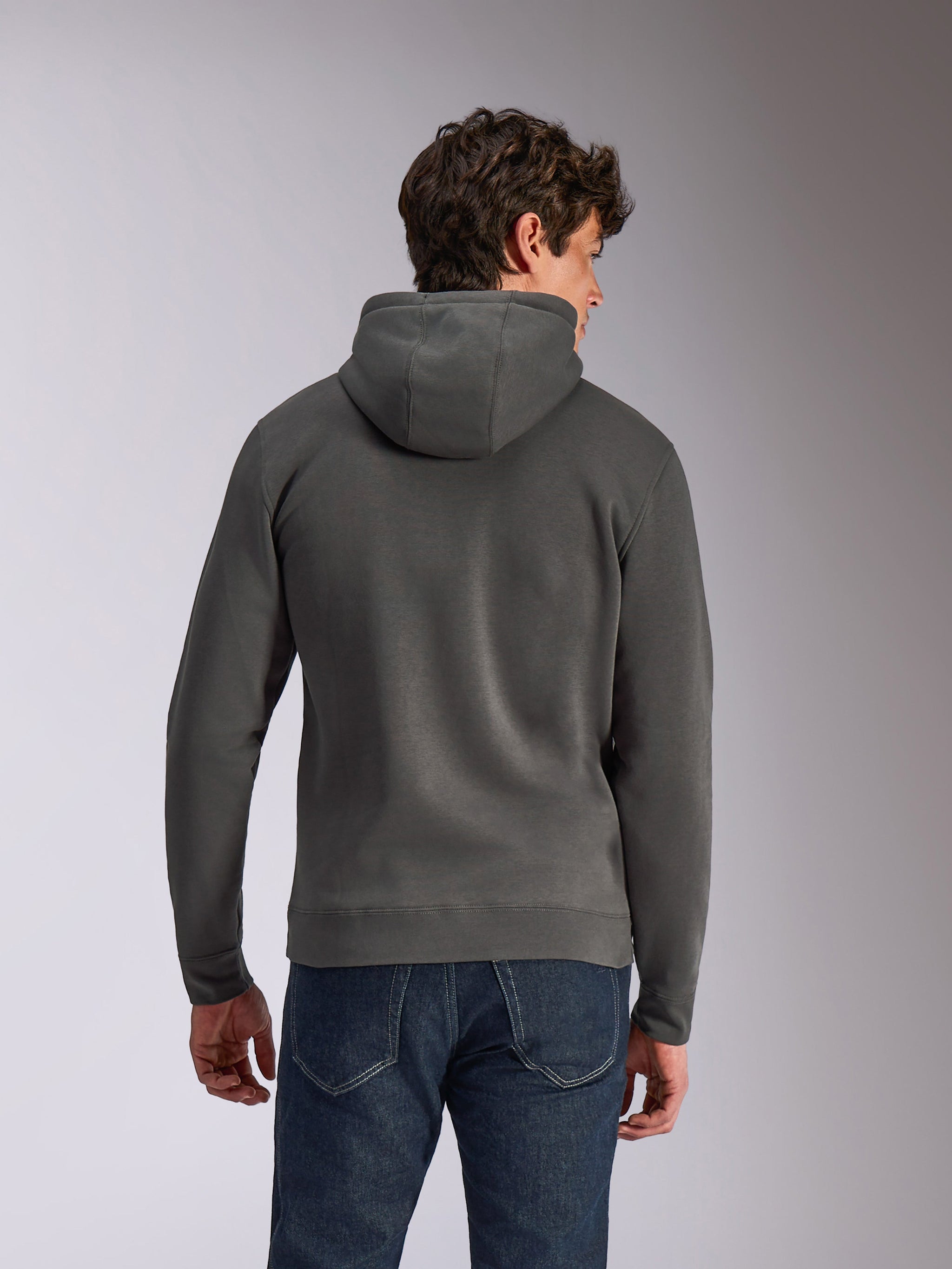 Alpinestars Ellipsoid Hoodie, Gunmetal gray, casual sportswear, rear view of man wearing hooded pullover fleece, ribbed hem and cuffs, paired with blue jeans