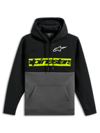 Alpinestars Parallel Hoodie, afslappet farveblokket pullover-fleece, sort overdel og ærmer med koksgrå bund, hvidt Astars-logo på brystet, lysende gulgrøn vandret bjælke med sort Alpinestars-ordlogo, hætte med snøre og kængurulomme foran