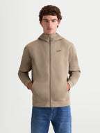 Alpinestars Cypher hættetrøje, motorsport-inspireret herrehættetrøje med gennemgående lynlås, beige, højhalset hætte, lommer i sidesømmene og sort Alpinestars-logo på brystet.
