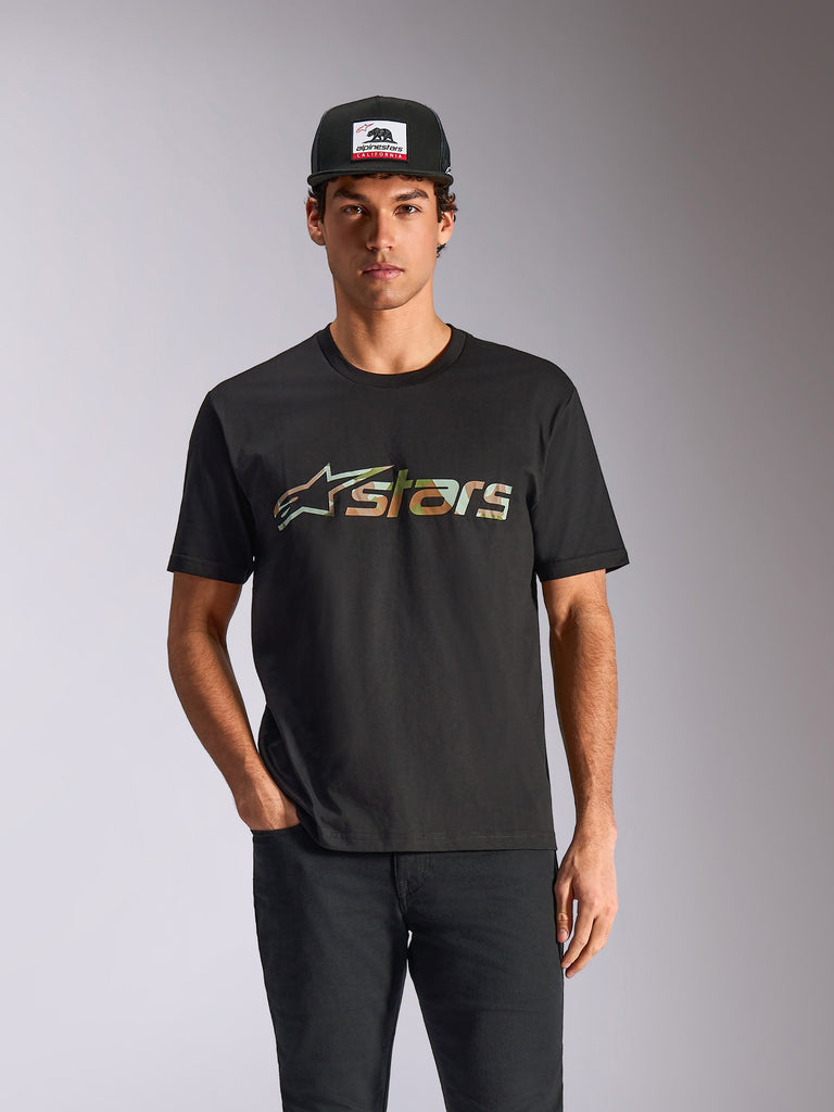 Alpinestars Verdure Camo CSF Tee, Short Sleeve T-Shirt, Black, worn by model with black cap and pants, featuring a front camo fill Astars logo, casual motorsport streetwear