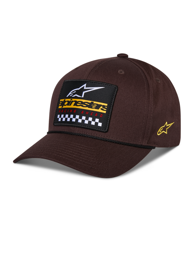 Alpinestars Matrix Snapback-kasket, brun, med broderet mærke på forsiden med hvidt logo, gul branding og ternet mønster, Astars-logo på siden, buet skygge, afslappet sportstøj