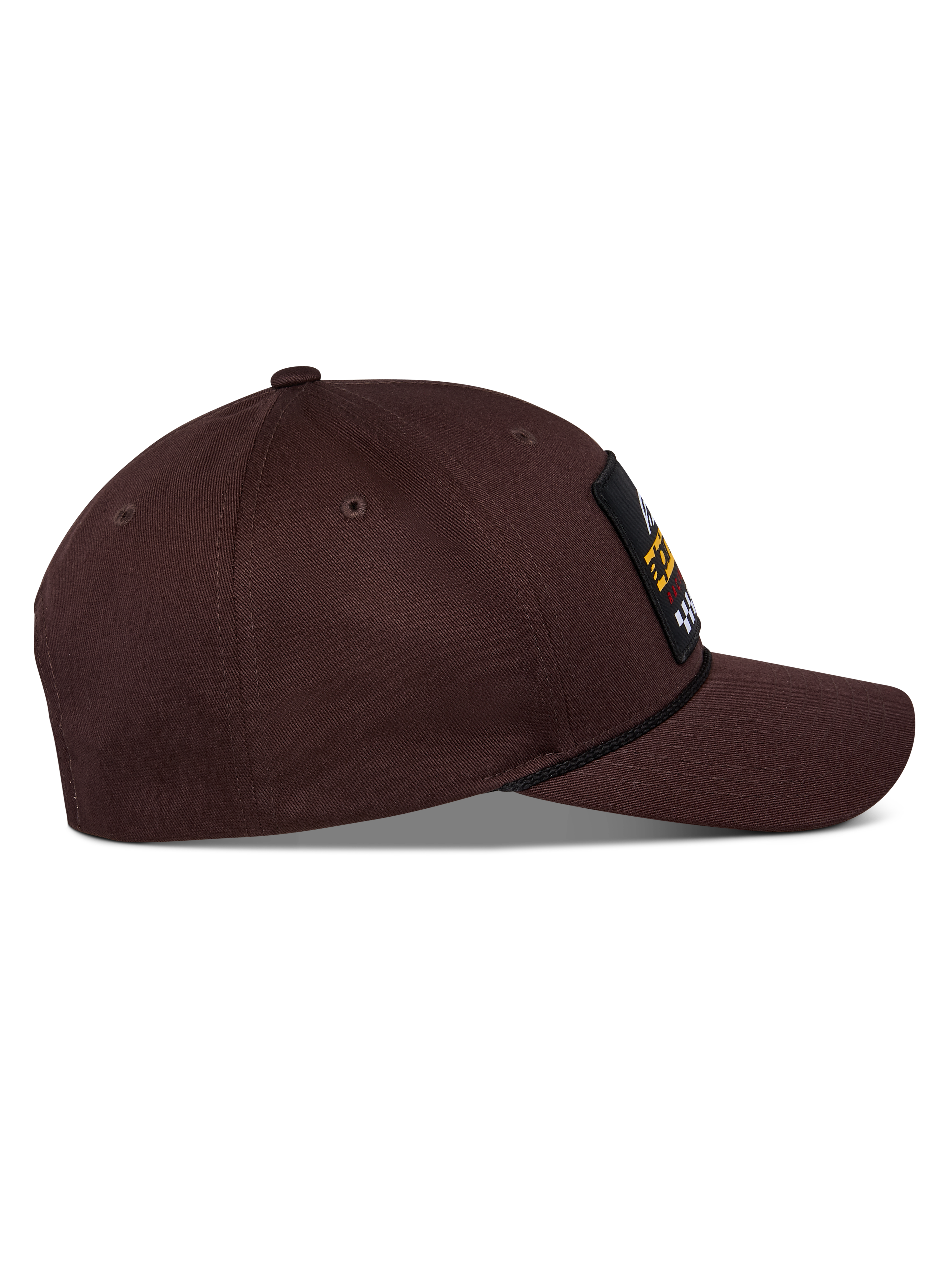 Alpinestars Matrix Snapback kasket, mørkebrun, sidevisning med buet skygge, struktureret krone og logomærke på fronten med snore-detalje, afslappet motorsport-inspireret hovedbeklædning