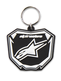 Alpinestars Plate nøglering, 3D-støbt nøglering, sort og hvid, med Astars MX-pladegrafik, hvidt logo og tekst, sølvfarvet metalsnapring, motorsport-inspireret tilbehør