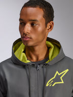 Alpinestars Speeder Chromium Windbreak Jacket, Charcoal Grey with Hi-Vis Yellow accents, featuring a yellow star logo on the chest and matching mesh hood lining, lightweight casual windbreaker