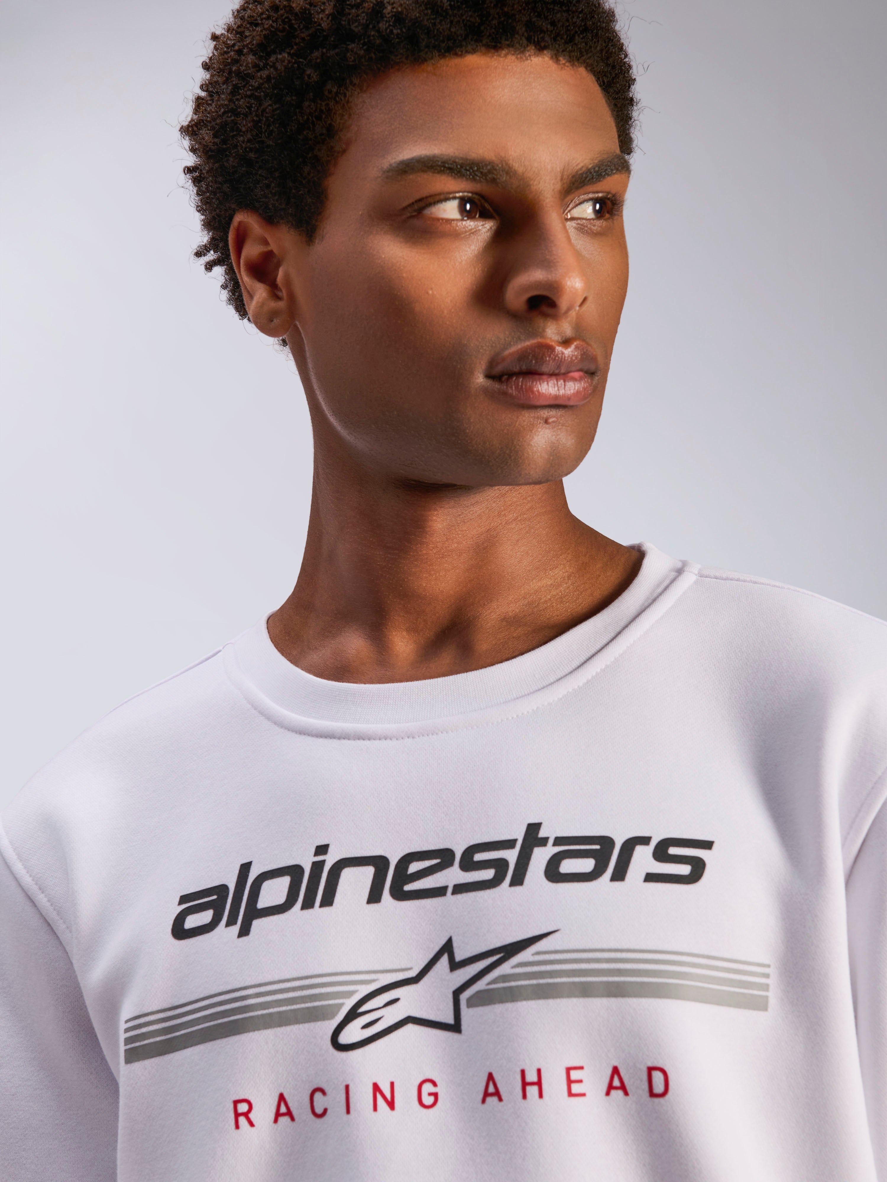 Alpinestars Bettern Crew, White Fleece Crewneck, Black Alpinestars logo with grey horizontal lines and red 'Racing Ahead' text, casual motorsport-inspired streetwear