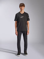 Alpinestars Frontal CSF Tee, Short Sleeve T-Shirt, Black, White Alpinestars logo on chest, worn by model with black pants and black shoes, casual performance sportswear