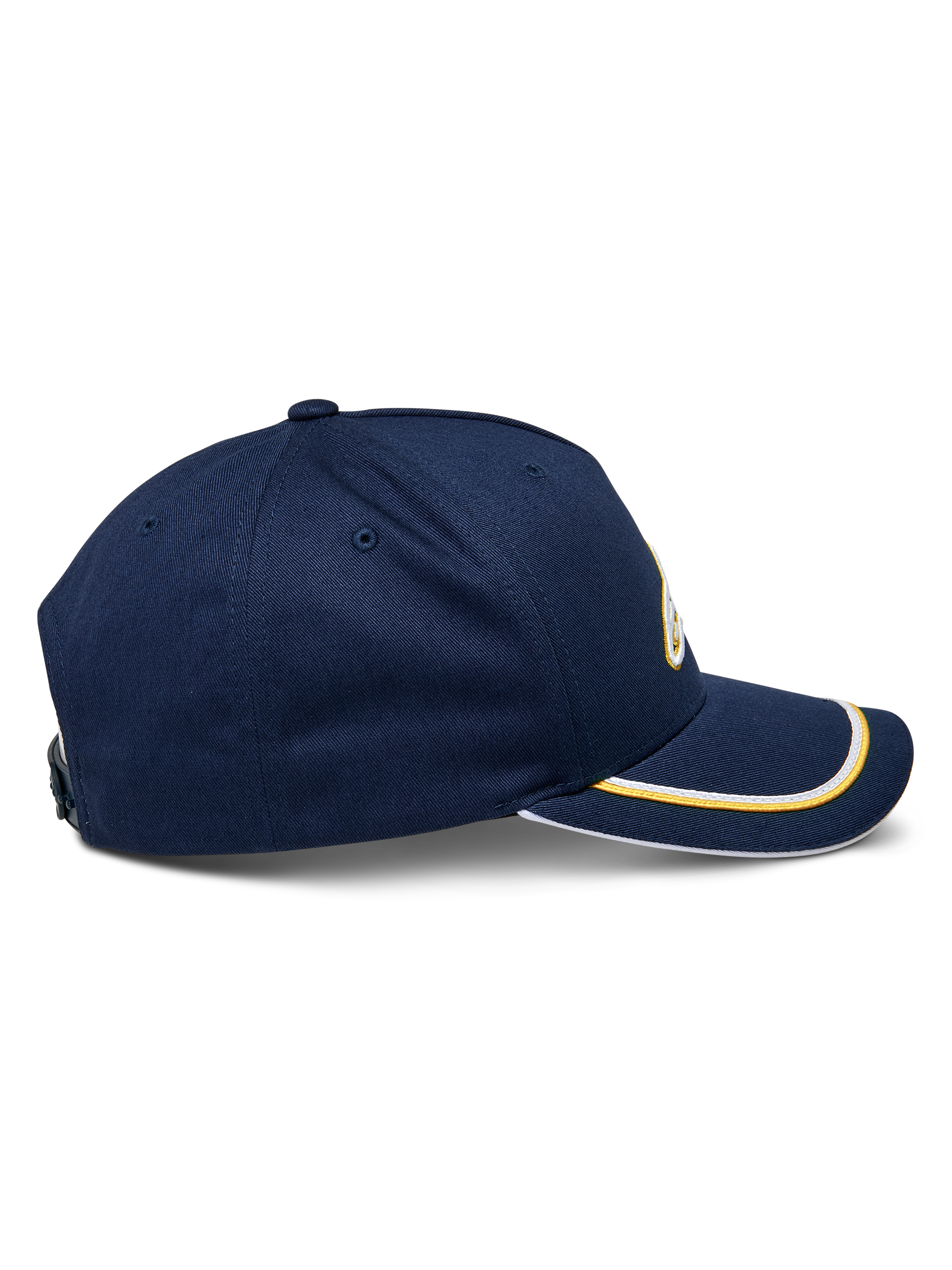 Alpinestars Ascension Snapback kasket, set fra siden, marineblå med guld og hvid sutache-kant på den buede skygge, struktureret krone, afslappet motorsport-hovedbeklædning