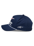 Alpinestars Ride Comp Snapback-kasket, marineblå, hvid og rød, set fra siden, struktureret krone med buet skygge, hvid flettet rebkant, broderet sidelogo, afslappet motorsport-hovedbeklædning