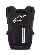 Alpinestars Defcon V3 Backpack, Black and White, small daily backpack featuring white star logo and vertical wordmark branding, front zipper pocket, padded shoulder straps, durable 600D polyester material