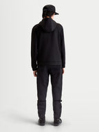 Alpinestars Datrix hættetrøje, premium sportstøj pullover, sort, set bagfra på model, tri-blend dobbeltsidet fleece med mesh-foret hætte og motorsport-inspireret stil.