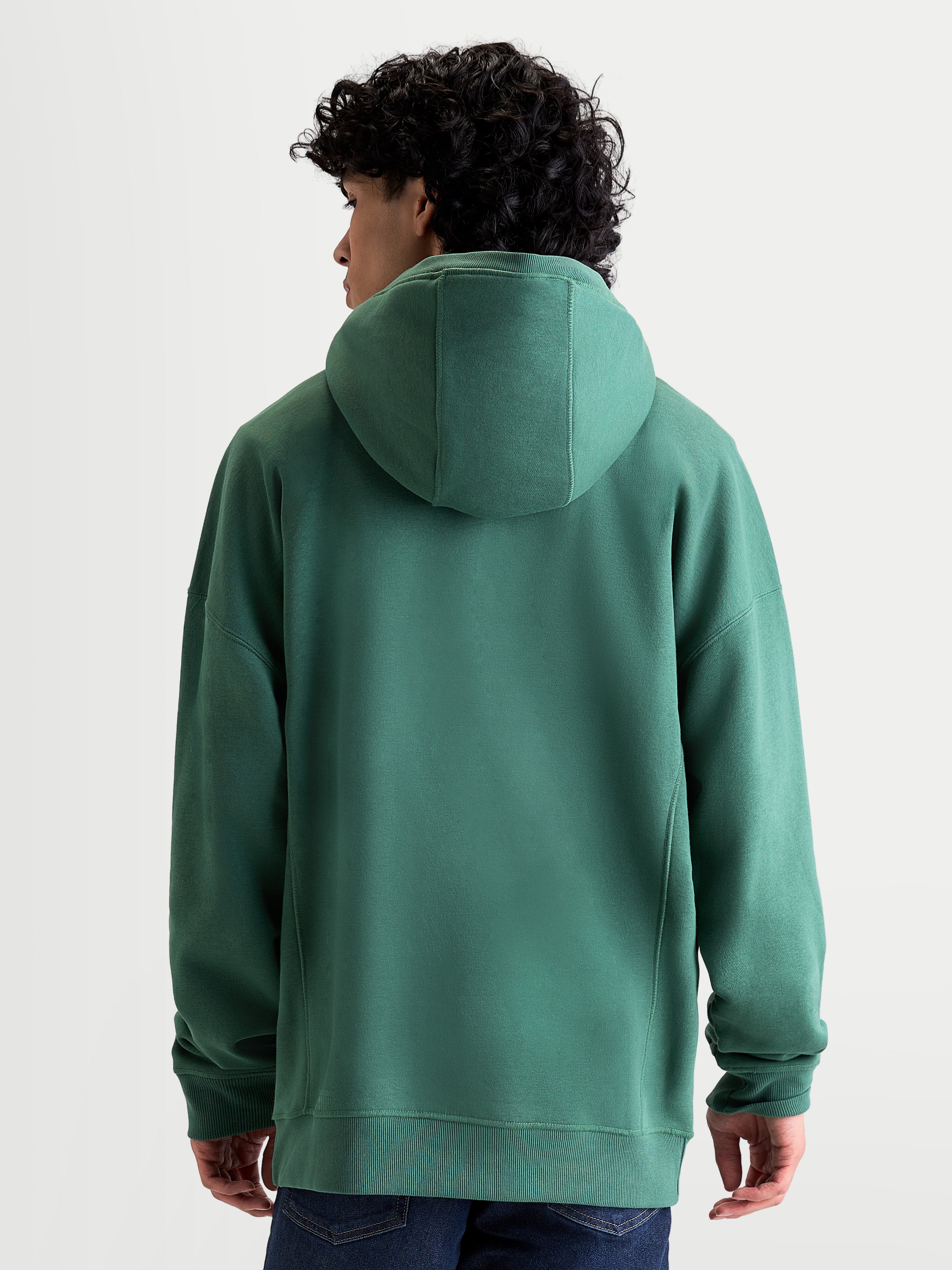 Alpinestars Shaw Oversized Hoodie, Green Sportswear Pullover, Unisex Relaxed Fit, Back View on Model, Self-Lined Hood and Ribbed Trims, Soft Cotton and Recycled Polyester Fleece Construction